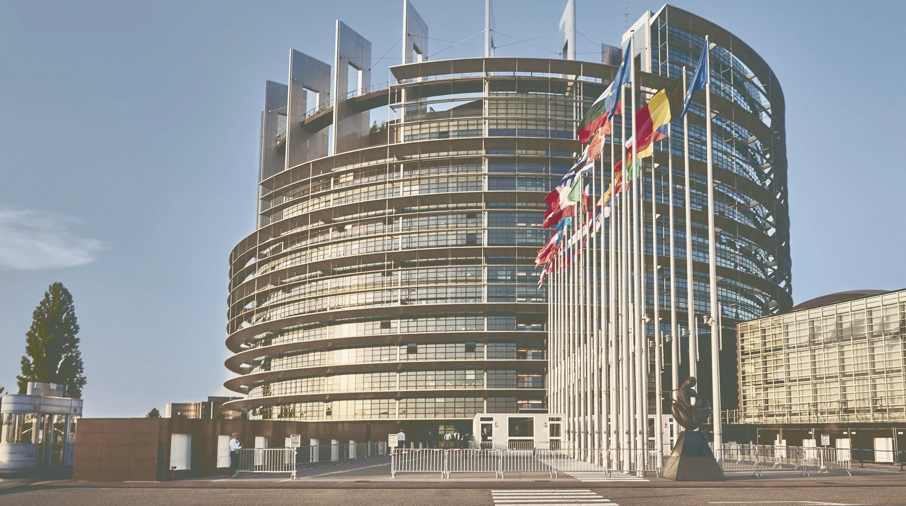 The European Parliament building with EU member flags