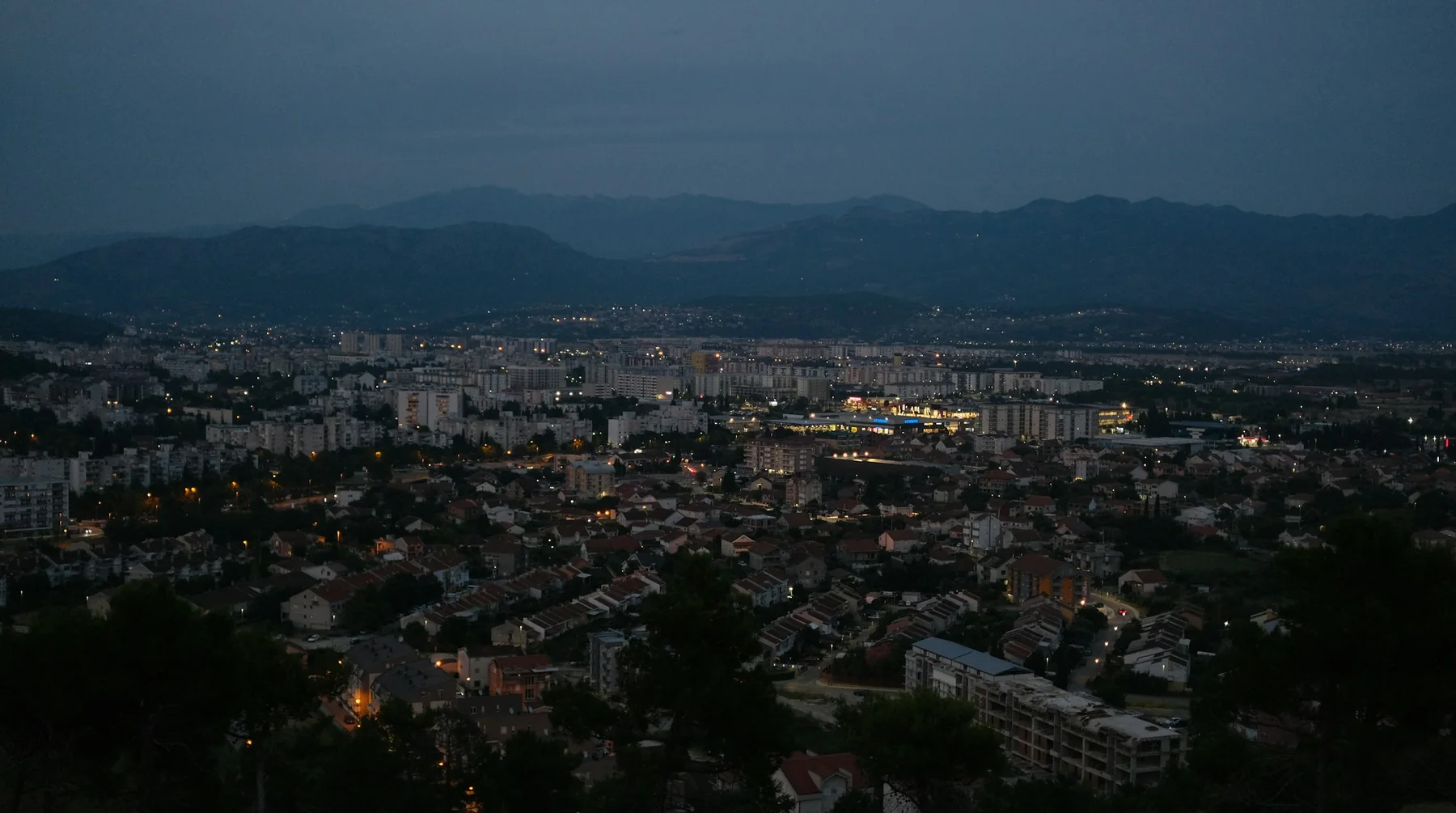 Podgorica at dusk below the mountains
