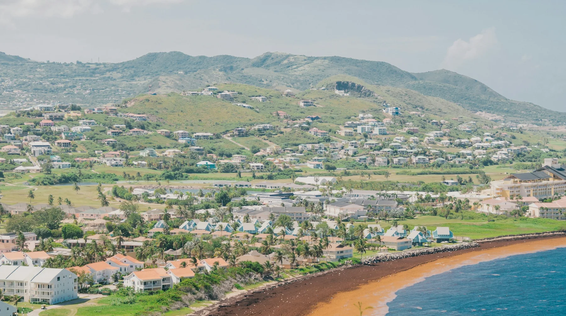 Coastal settlement on St Kitts below the hills