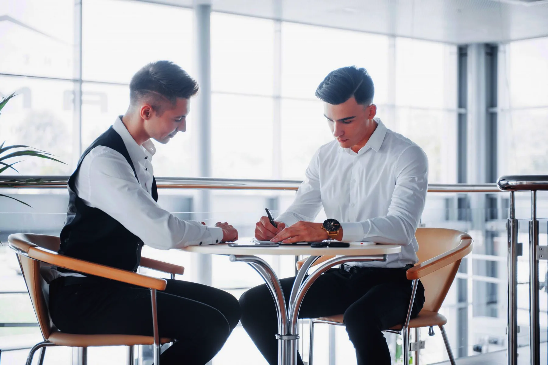 A business owner and a senior BRIDGES adviser reviewing a corporate structure