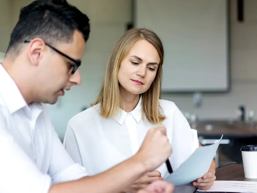 Specialists going through a company’s documents as the file is taken over