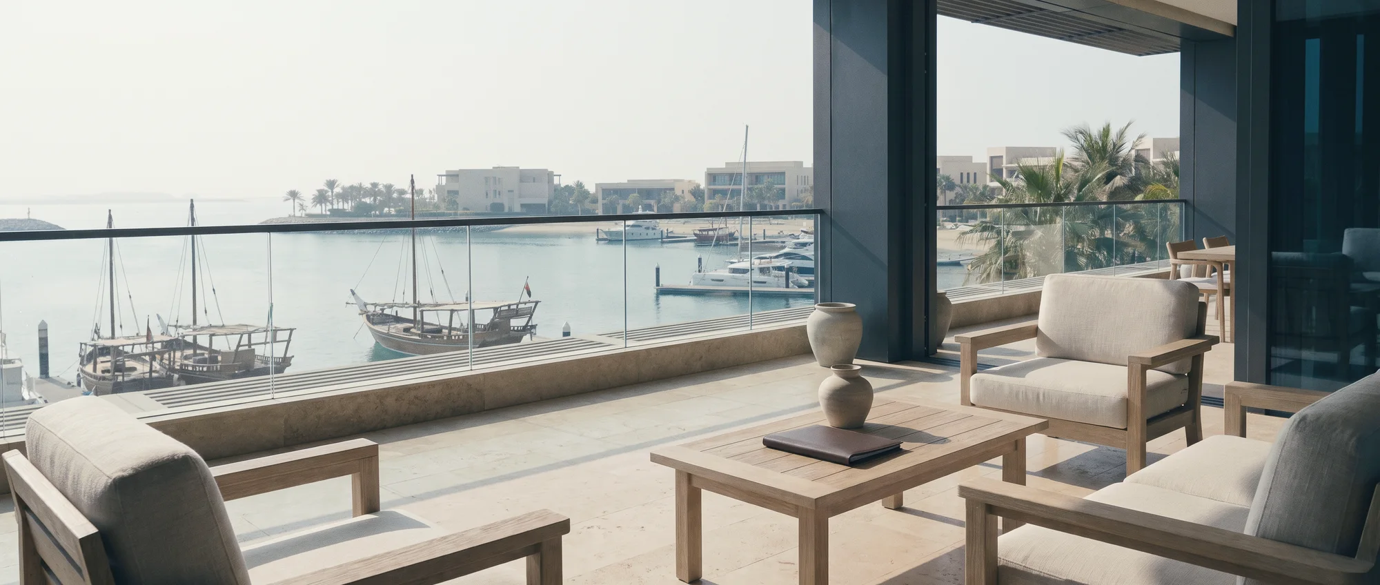 An office terrace over a calm tropical bay with boats